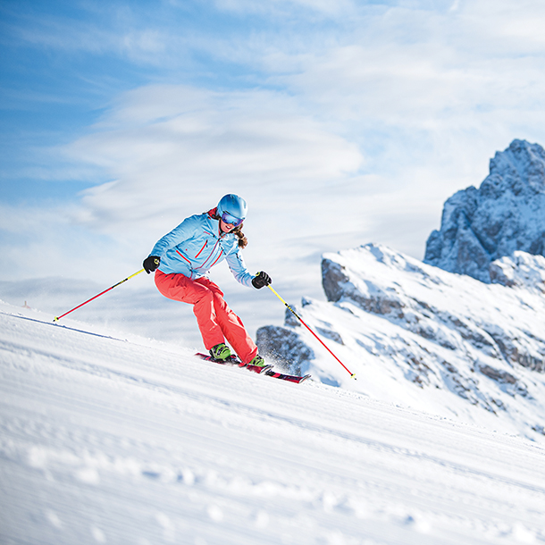 Female downhill skiing at Val Gardena